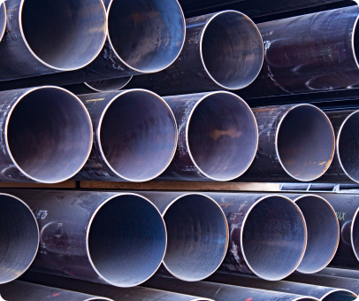 Carbon pipe arranged in horizontal stacks.