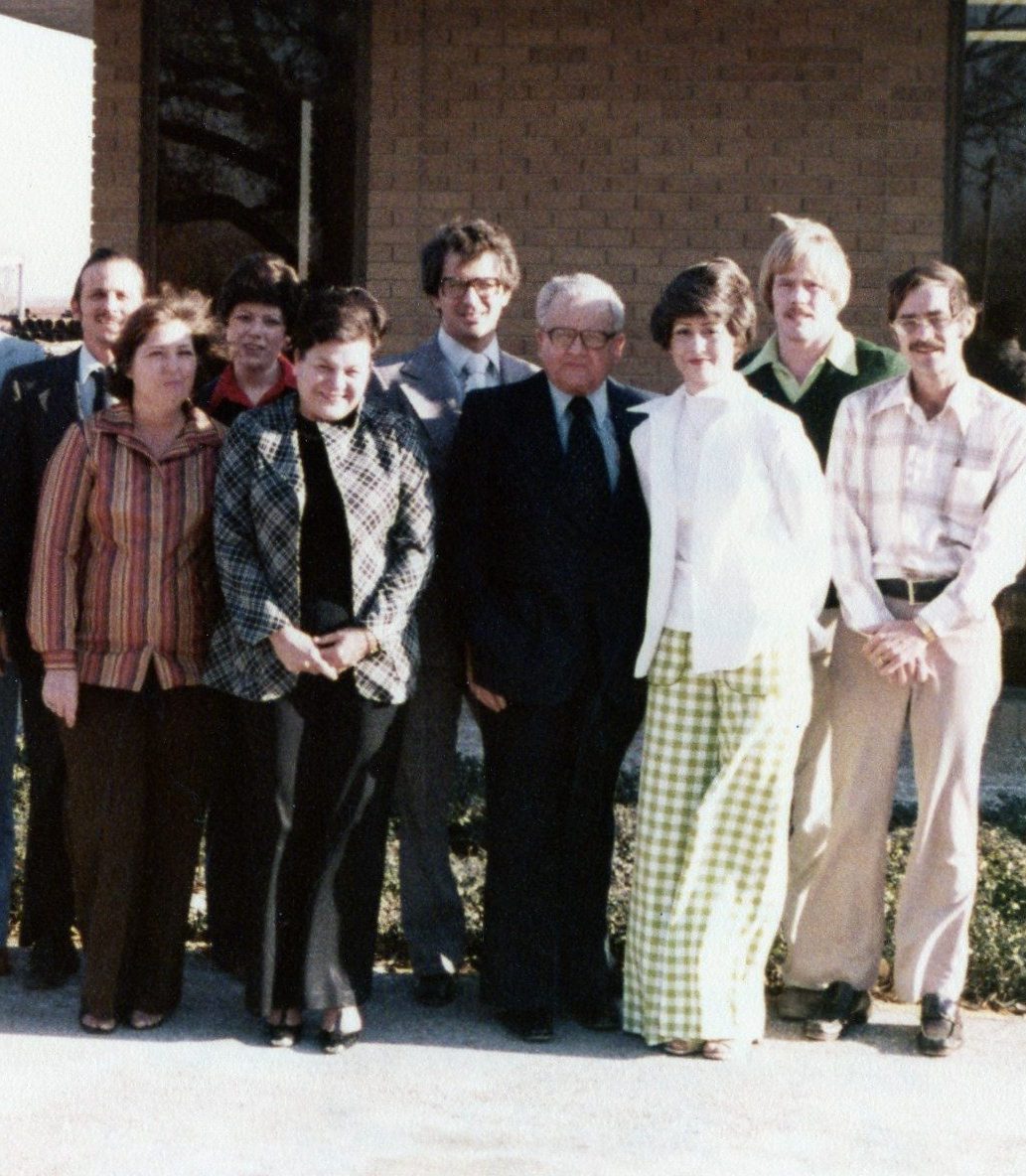1970s era photo of Texas Pipe & Supply employees standing outside the original headquarters.